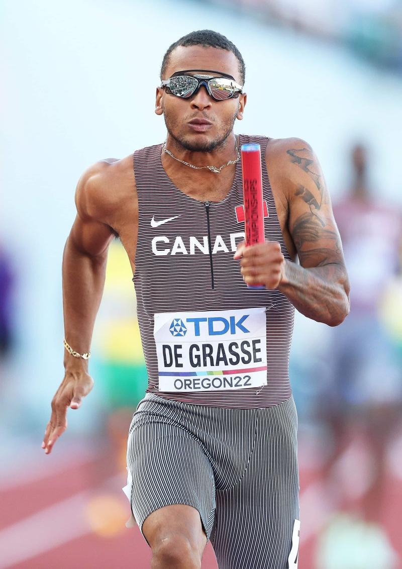 Andre De Grasse Surprised by Usain Bolt During Interview